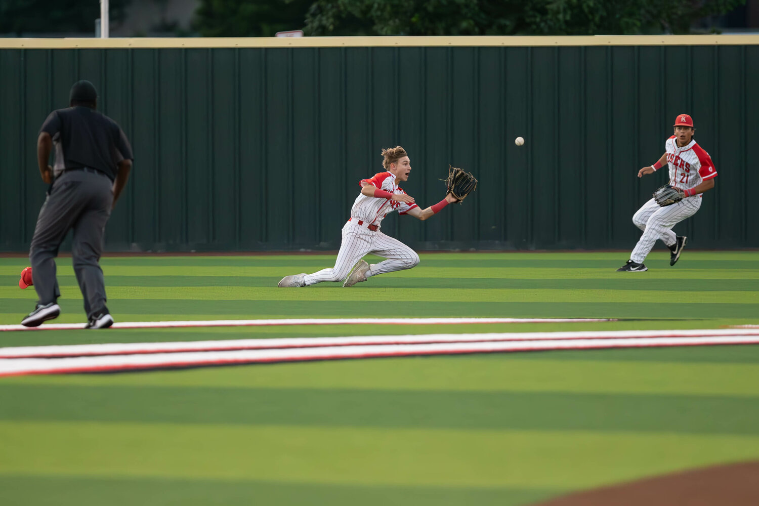 Andrew Hilton makes a diving catch during Thursday's Regional Semifinal between Katy and Clear Springs at Langham Creek.